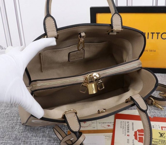 Louis Vuitton Monogram Empreinte Montaigne MM In Tourterelle Gray angle 3
