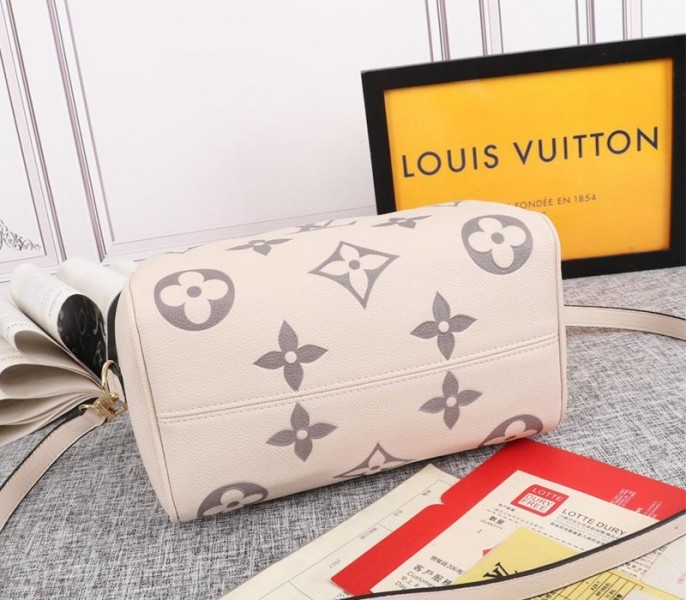 Louis Vuitton Bicolor Monogram Empreinte Leather Speedy Bandouliere 25 Handbag In Cream And Bois De Rose Pink angle 4