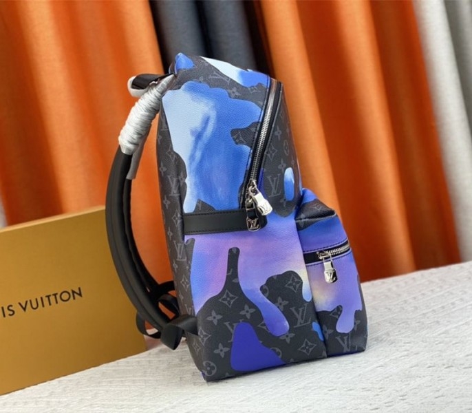 Louis Vuitton Monogram Eclipse Discovery Backpack In Blue Sunrise angle 3