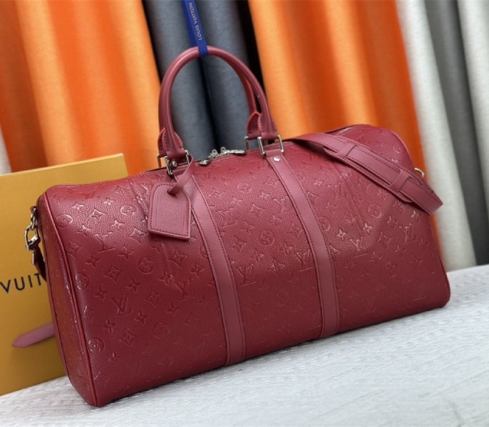 Louis Vuitton Taurillon Leather Keepall Bandouliere 50 In Sari Red angle 2