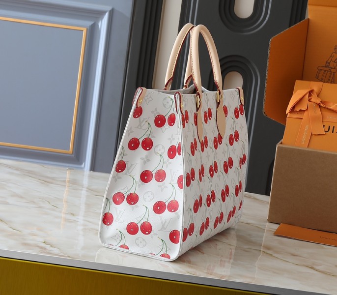 X TM Monogram Cherry Canvas Onthego MM In White Style 1 angle 2