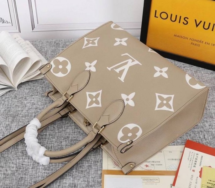 Louis Vuitton Monogram Empreinte OnTheGo MM Tote In Tourterelle Gray angle 4