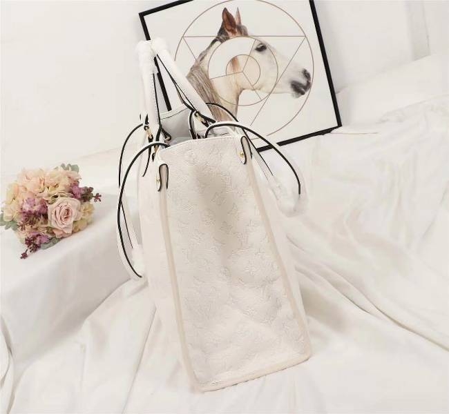 Louis Vuitton Monogram Empreinte Giant Onthego GM Tote In Cream angle 4