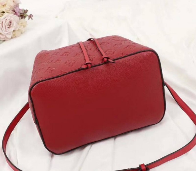 Louis Vuitton Monogram Empreinte NeoNoe MM Bag In Red angle 5
