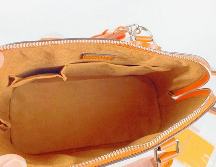 Louis Vuitton Epi Leather Alma PM Handbag In Orange With Jacquard Strap angle 5