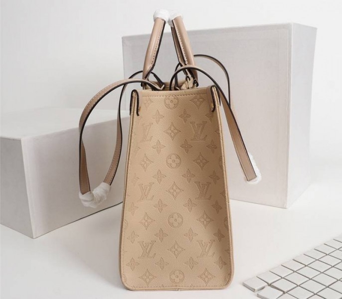 Louis Vuitton Monogram Empreinte Giant Onthego MM Bag In Beige angle 3