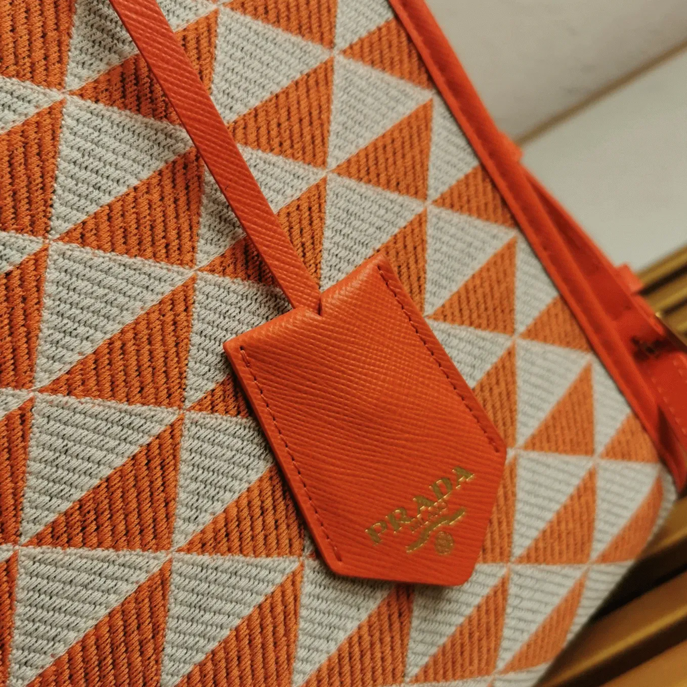 Prada Symbole Small Bag Fake in Orange/White Jacquard Fabric angle 2