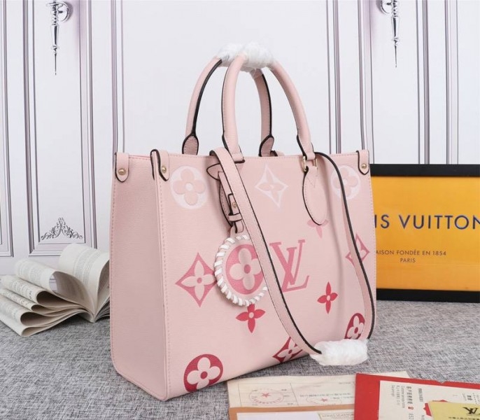 Louis Vuitton Monogram Empreinte Leather Onthego MM Bag In Pink angle 2