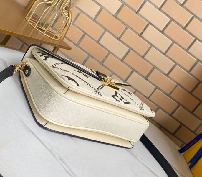 Louis Vuitton Spring 2022 Monogram Empreinte Pochette Metis Handbag In Cream angle 4