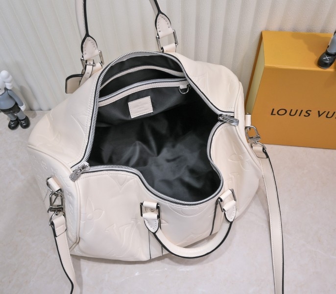 LV Monogram Empreinte Keepall Bandouliere 45 In Cream angle 4