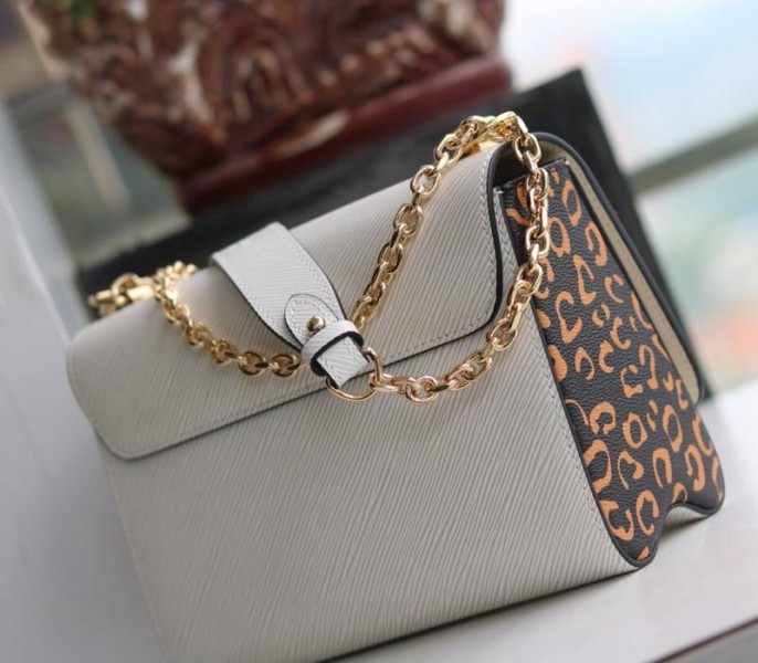 Louis Vuitton Epi Leather Jungle Edition Twist MM Bag In Optic White angle 4