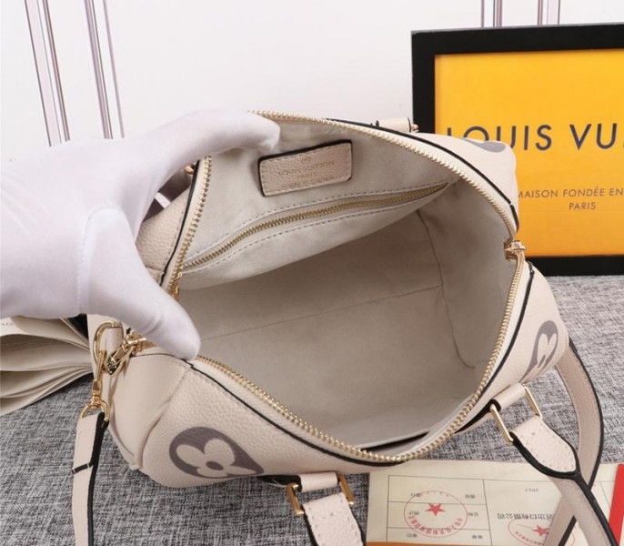 Louis Vuitton Bicolor Monogram Empreinte Leather Speedy Bandouliere 25 Handbag In Cream And Bois De Rose Pink angle 5