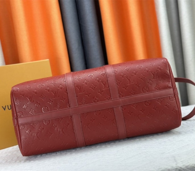 Louis Vuitton Taurillon Leather Keepall Bandouliere 50 In Sari Red angle 5