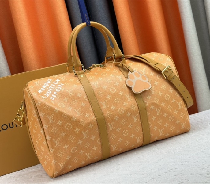 Louis Vuitton Monogram Heritage Canvas Keepall Bandouliere 45 In Yellow angle 2
