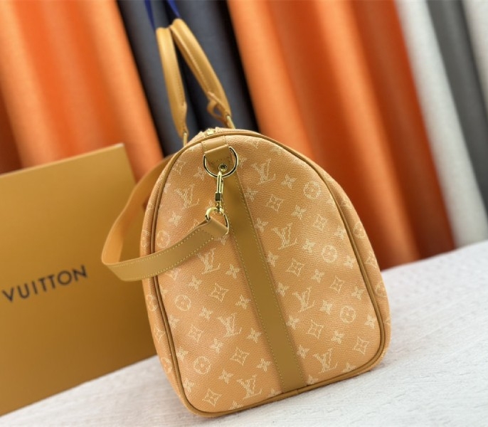 Louis Vuitton Monogram Heritage Canvas Keepall Bandouliere 50 In Yellow angle 4