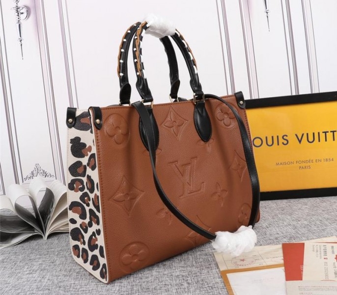 Louis Vuitton Monogram Empreinte Wild At Heart Onthego MM Tote In Caramel Brown angle 2