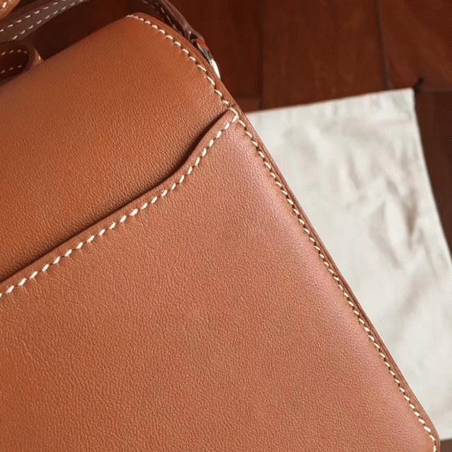Caramel replica Hermes Mini Sac Roulis handbag angle 2