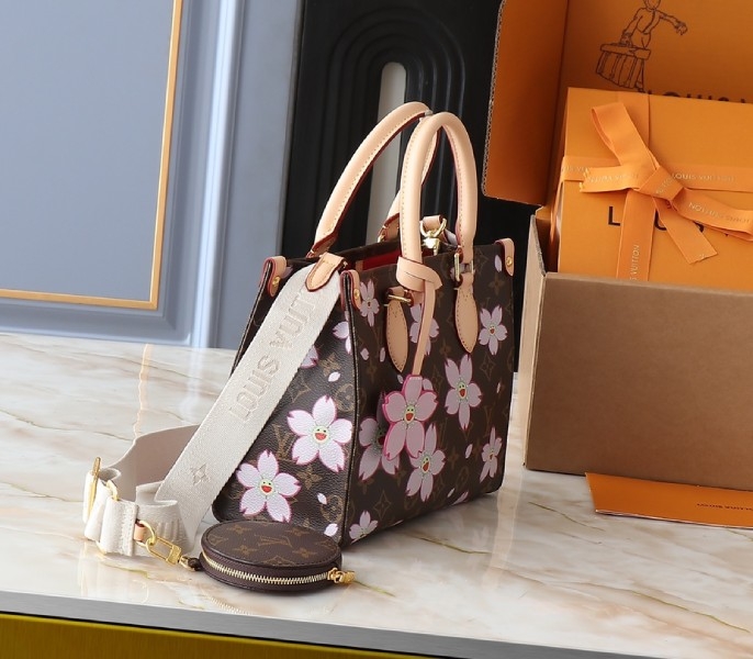 X TM Monogram Canvas Onthego PM With Cherry Blossom angle 2