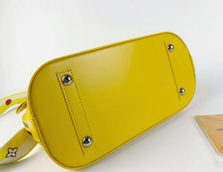 Louis Vuitton Epi Leather Alma PM Handbag In Cedrat Yellow With Jacquard Strap angle 5