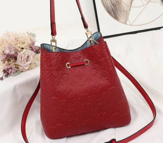 Louis Vuitton Monogram Empreinte NeoNoe MM Bag In Red angle 3
