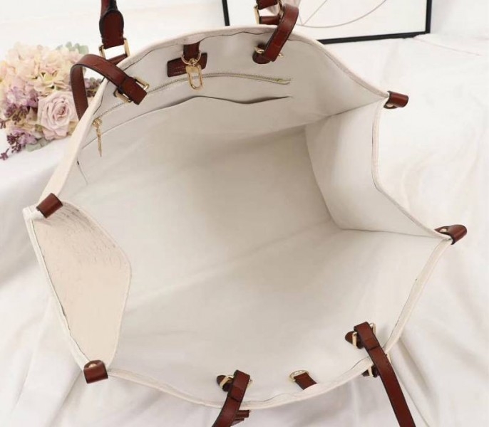 Louis Vuitton Monogram Empreinte Onthego GM Tote In Cream angle 5