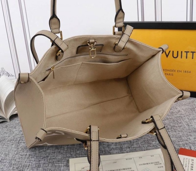 Louis Vuitton Monogram Empreinte OnTheGo MM Tote In Tourterelle Gray angle 5