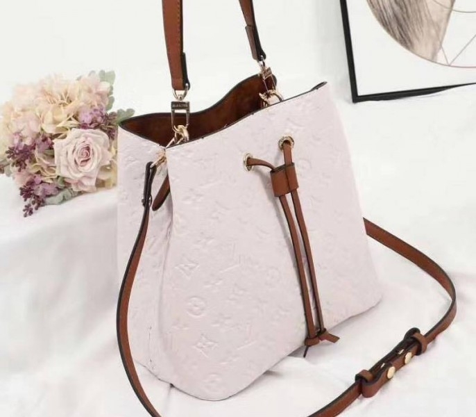 Louis Vuitton Monogram Empreinte NeoNoe MM Bag In Cream angle 2