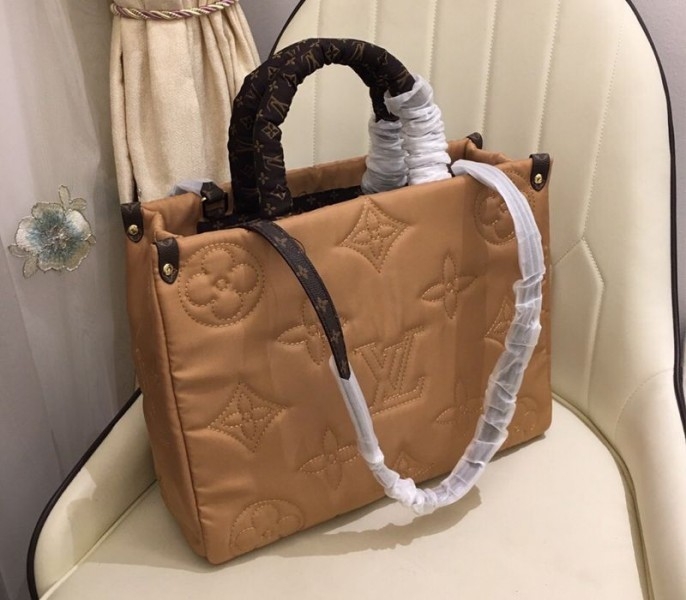 Louis Vuitton Econyl Regenerated Nylon Onthego GM Tote In Beige angle 4
