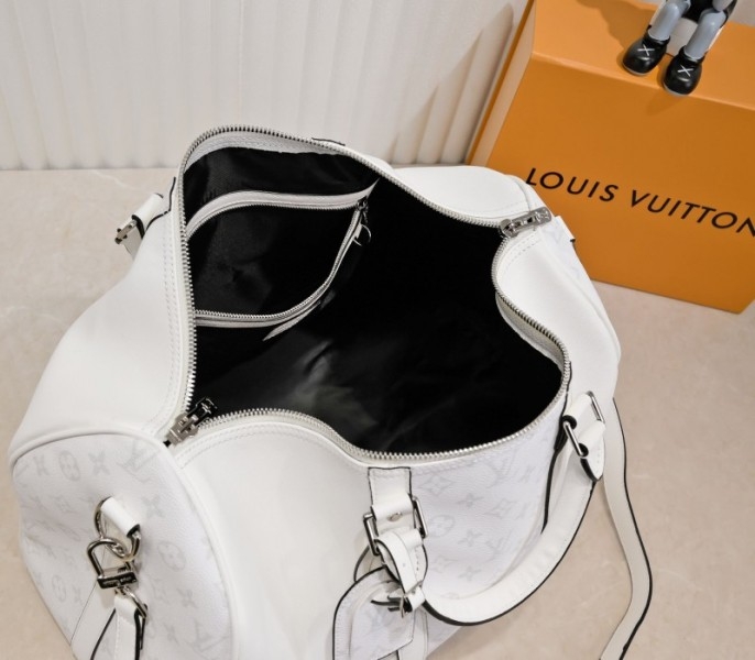 Louis Vuitton Taiga Leather Keepall Bandouliere 50 Travel Bag In White angle 5