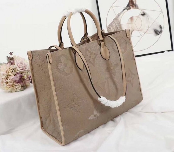 Louis Vuitton Monogram Empreinte Giant Onthego GM Tote In Beige angle 2