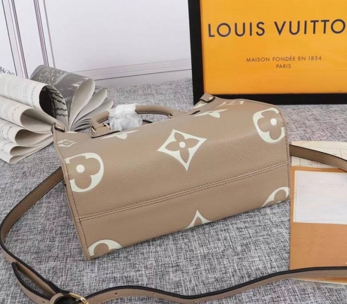 Louis Vuitton Bicolor Monogram Empreinte Leather Onthego PM Bag In Tourterelle Gray And Cream angle 4