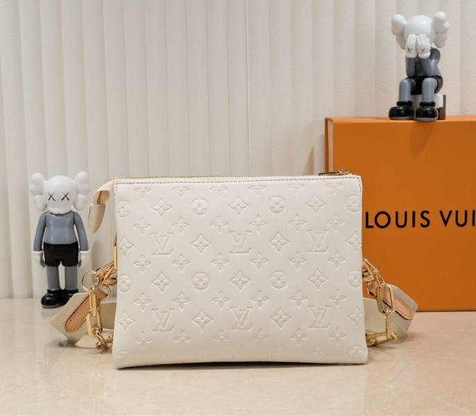 Louis Vuitton Coussin PM Bag In Cream With Jacquard Strap angle 3
