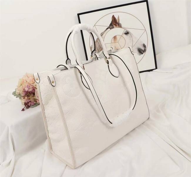 Louis Vuitton Monogram Empreinte Giant Onthego GM Tote In Cream angle 3