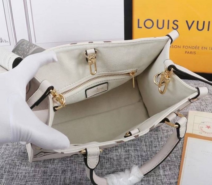 Louis Vuitton Bicolor Monogram Empreinte Leather Onthego PM Bag In Cream And Bois De Rose Pink angle 5