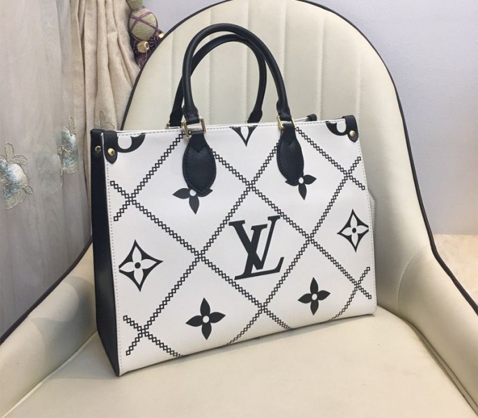 Louis Vuitton Spring 2022 Monogram Empreinte Onthego MM Tote In Cream angle 2
