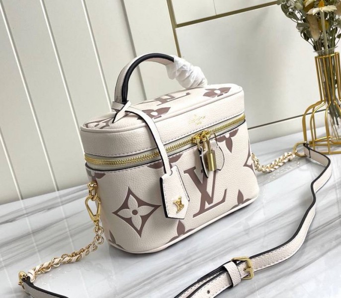Louis Vuitton Bicolor Monogram Empreinte Vanity PM Bag In Cream And Bois De Rose Pink angle 2