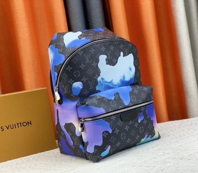 Louis Vuitton Monogram Eclipse Discovery Backpack In Blue Sunrise angle 2