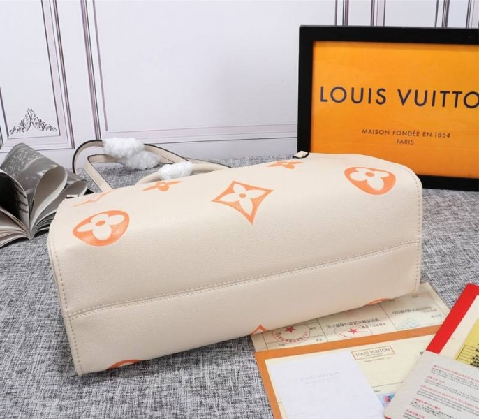 Louis Vuitton Monogram Empreinte Leather Onthego MM Bag In Cream Saffron angle 4