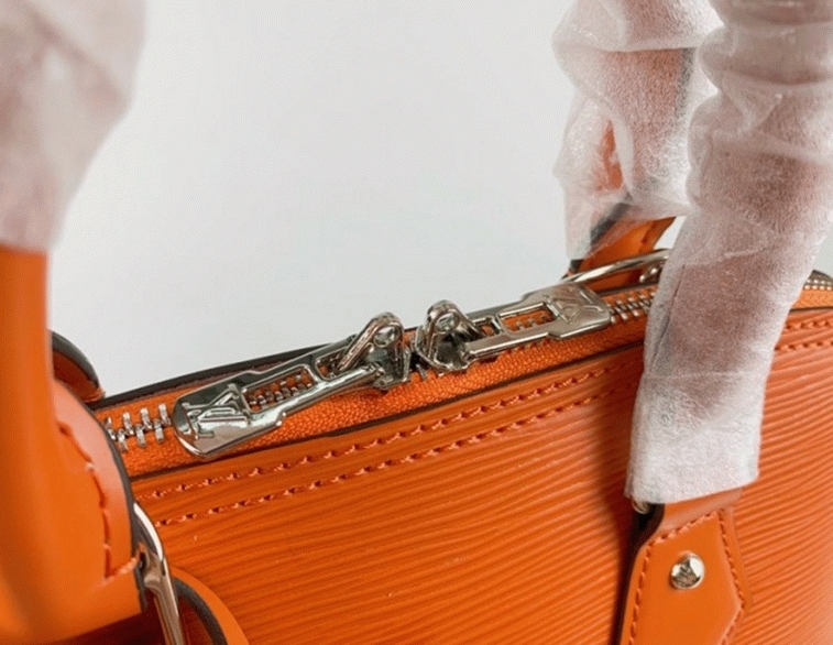 Louis Vuitton Epi Leather Alma PM Handbag In Orange With Jacquard Strap angle 3
