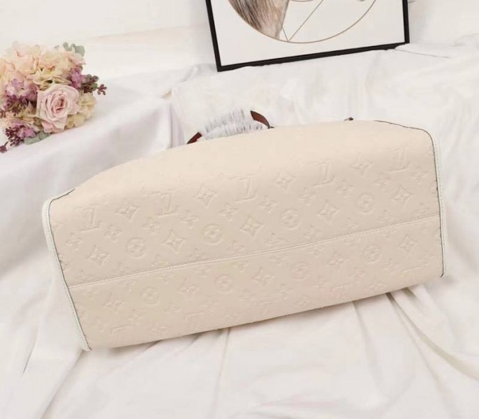 Louis Vuitton Monogram Empreinte Onthego GM Tote In Cream angle 4