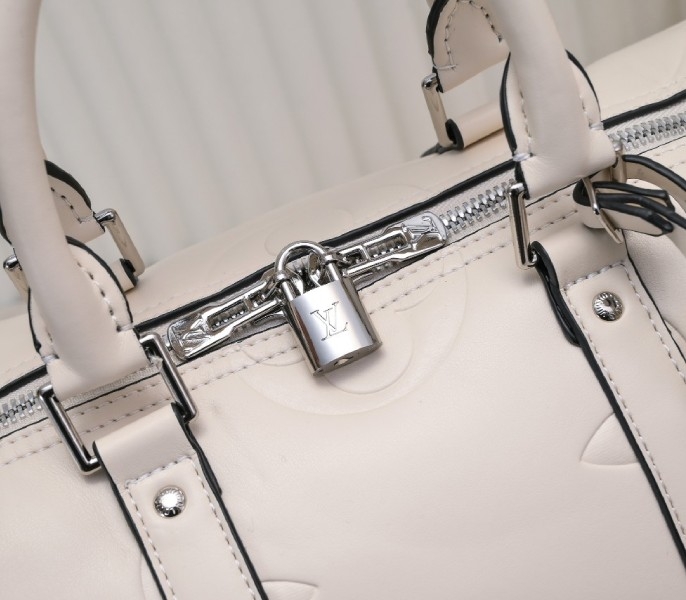 LV Monogram Empreinte Keepall Bandouliere 45 In Cream angle 5