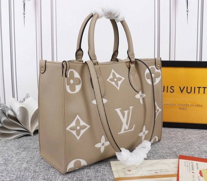 Louis Vuitton Monogram Empreinte OnTheGo MM Tote In Tourterelle Gray angle 2