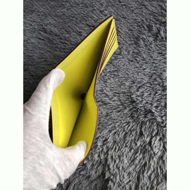 Yellow knockoff Hermes Copernic compact wallet angle 3