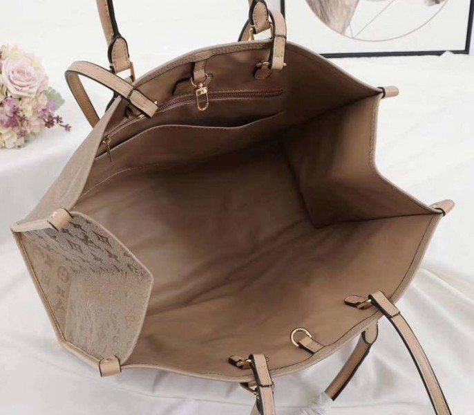 Louis Vuitton Monogram Empreinte Giant Onthego GM Tote In Beige angle 5